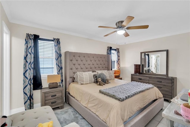 bedroom featuring baseboards, ceiling fan, and crown molding