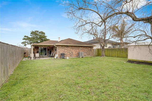 view of yard featuring central AC unit, a patio, an outdoor structure, and a fenced backyard