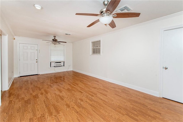 unfurnished living room with crown molding, visible vents, light wood finished floors, and ceiling fan