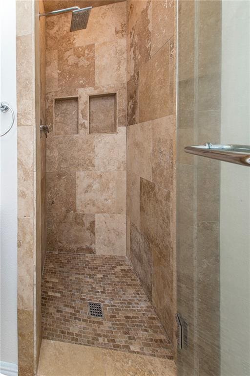 bathroom featuring a shower stall