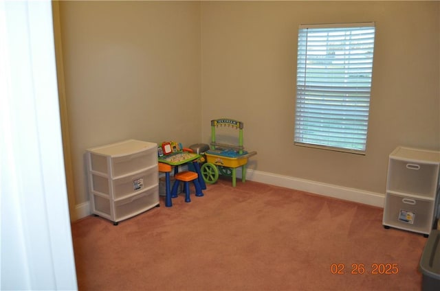 game room featuring baseboards and carpet floors