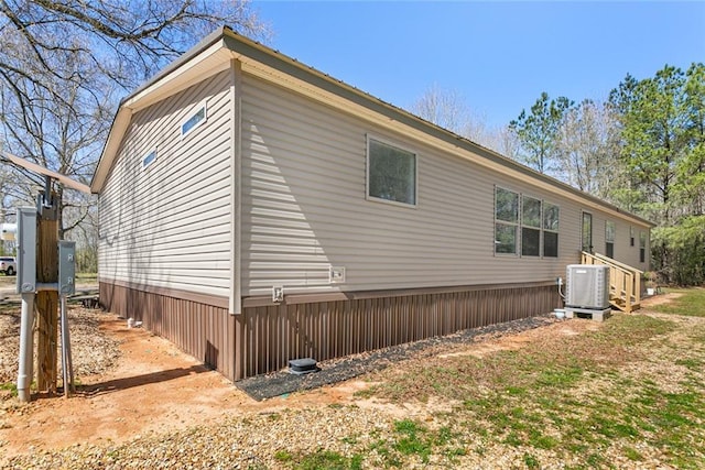 view of home's exterior with central air condition unit