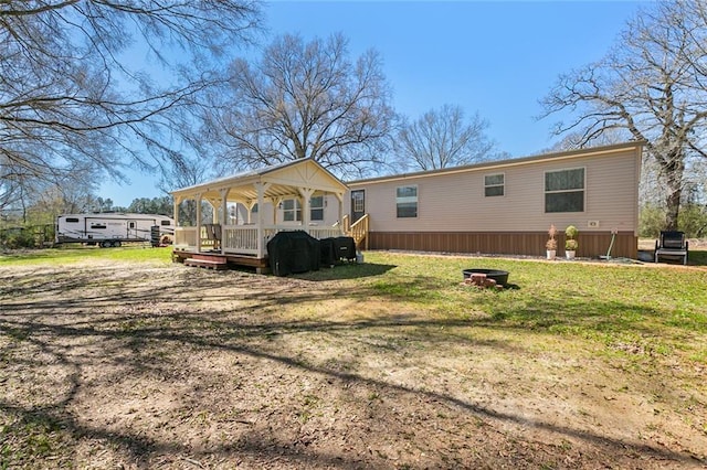 20228 Stafford Rd, Kentwood, LA 70444 - back of property featuring a yard