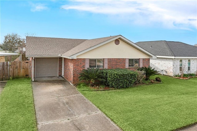 single story home featuring brick siding, a front lawn, fence, concrete driveway, and an attached garage