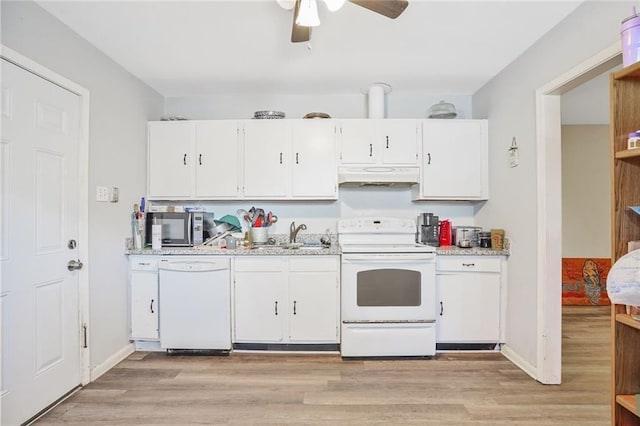 kitchen with under cabinet range hood, white appliances, white cabinets, and a sink