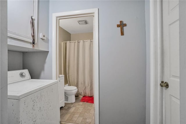 bathroom with visible vents, washer / clothes dryer, toilet, and curtained shower