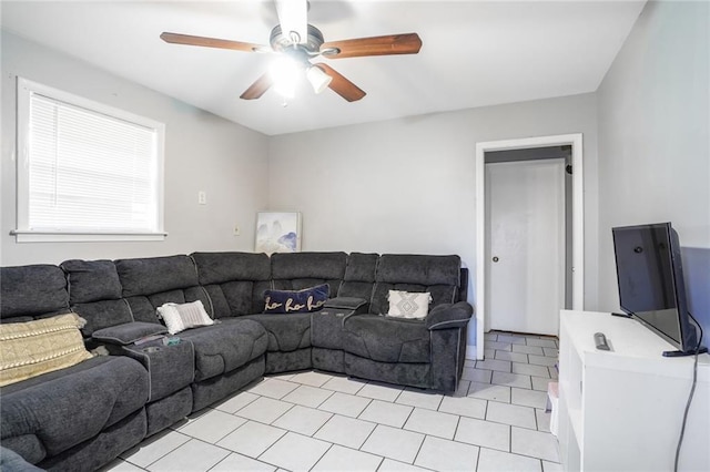 living area featuring light tile patterned flooring and a ceiling fan