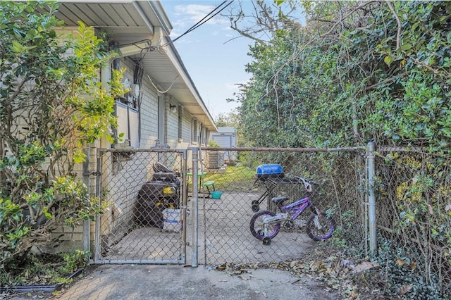 view of yard featuring fence and a gate