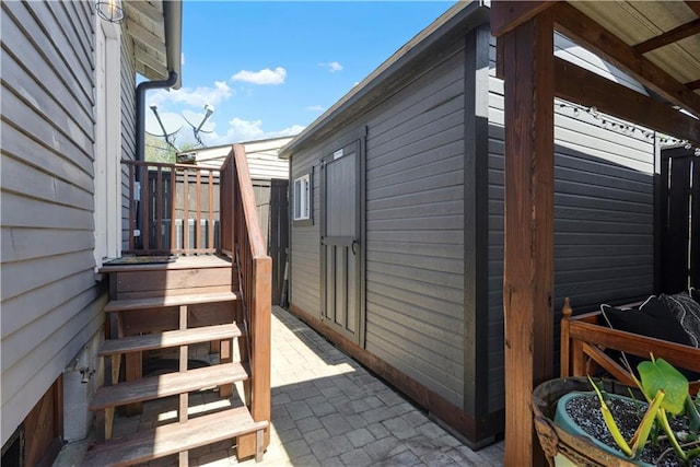 view of property exterior with a patio area