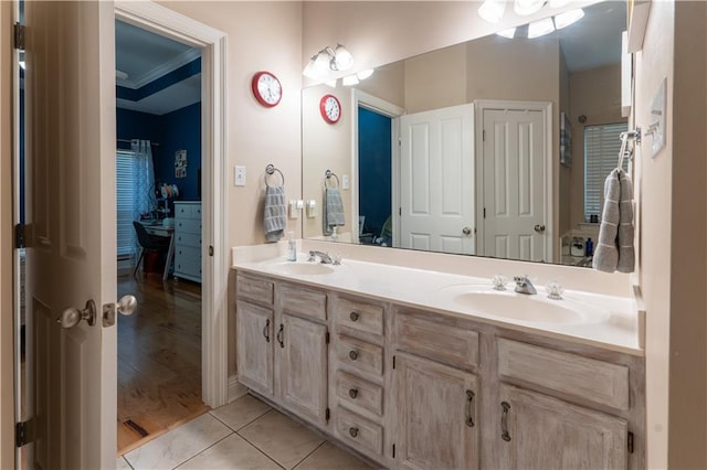 bathroom featuring tile patterned floors, double vanity, and a sink