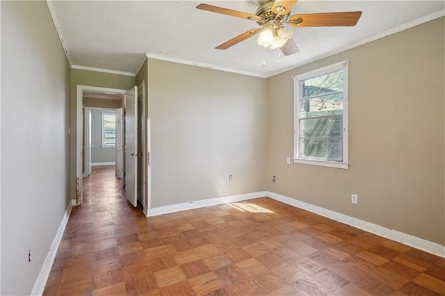 unfurnished room featuring crown molding, baseboards, and ceiling fan