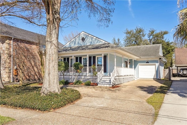 view of front of home featuring driveway, a gate, covered porch, an attached garage, and a shingled roof