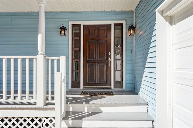 doorway to property featuring a porch