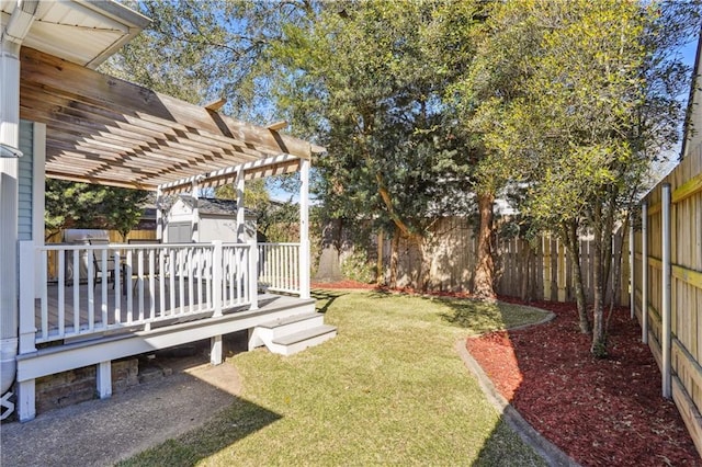 view of yard featuring an outbuilding, a fenced backyard, a pergola, and a shed