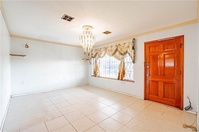 spare room featuring crown molding, a notable chandelier, visible vents, and light tile patterned floors