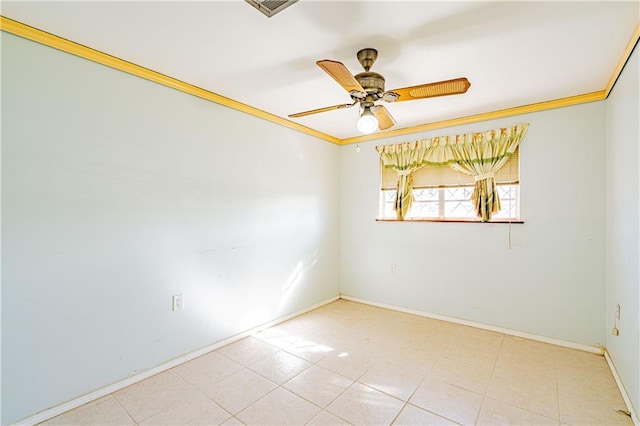 empty room with baseboards, ceiling fan, and crown molding