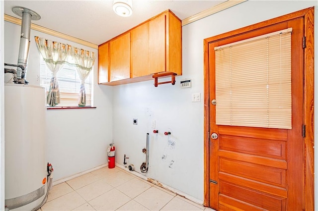 laundry room with gas water heater, hookup for a gas dryer, cabinet space, hookup for an electric dryer, and hookup for a washing machine