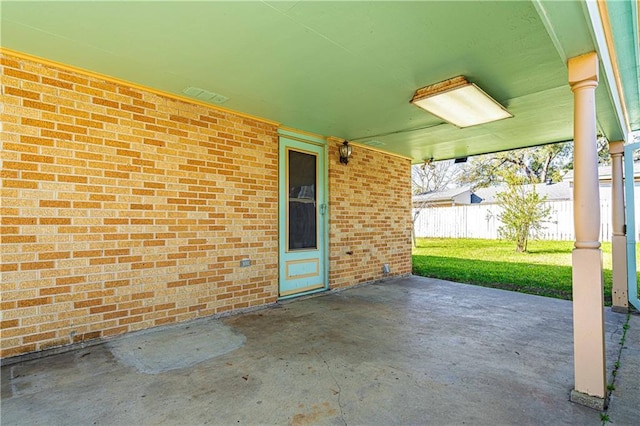 view of patio / terrace featuring fence