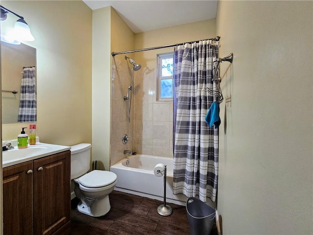 full bath with toilet, wood finished floors, vanity, and shower / bath combination with curtain