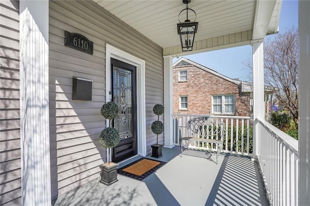 entrance to property featuring covered porch