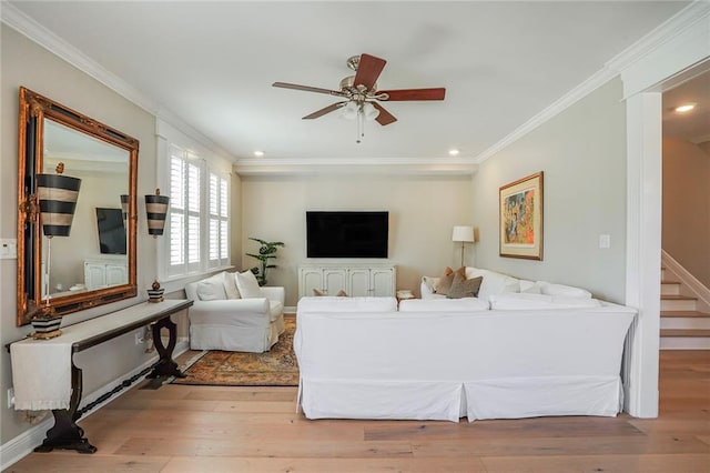 living room featuring ornamental molding, hardwood / wood-style floors, recessed lighting, ceiling fan, and stairs