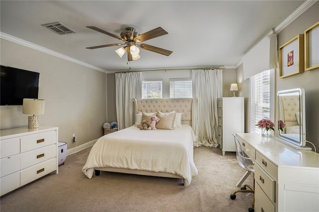 bedroom with visible vents, light colored carpet, crown molding, and a ceiling fan