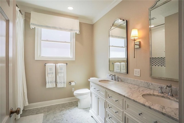 full bathroom featuring ornamental molding, toilet, baseboards, and a sink