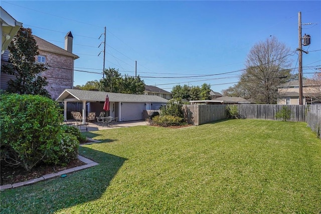 view of yard with a patio and a fenced backyard