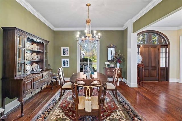 dining space featuring a wealth of natural light, baseboards, a notable chandelier, and wood finished floors