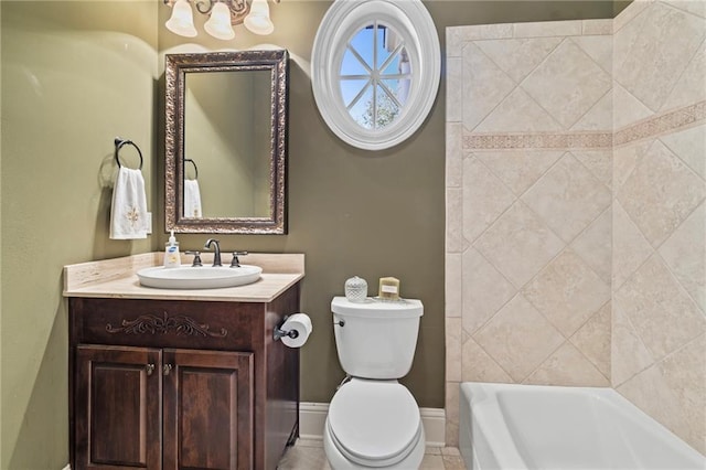 full bath featuring vanity, a notable chandelier, toilet, and baseboards