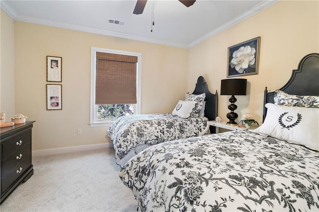 bedroom with visible vents, light colored carpet, crown molding, and baseboards