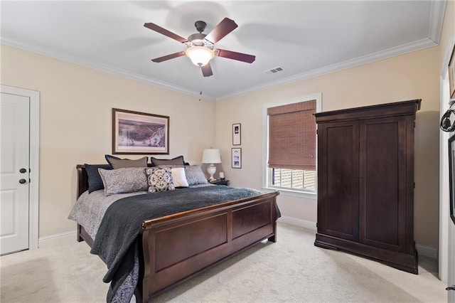 bedroom featuring visible vents, light carpet, baseboards, and ornamental molding