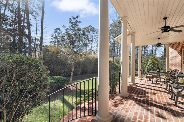 wooden deck with a ceiling fan and covered porch