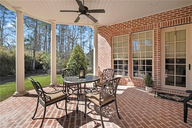 view of patio featuring outdoor dining space and a ceiling fan