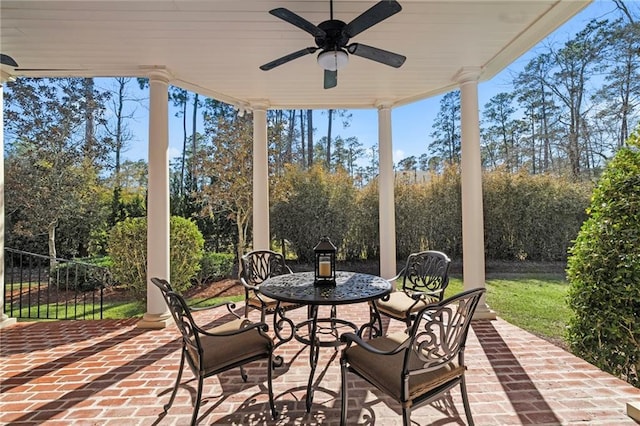 view of patio / terrace with outdoor dining area, a ceiling fan, and fence