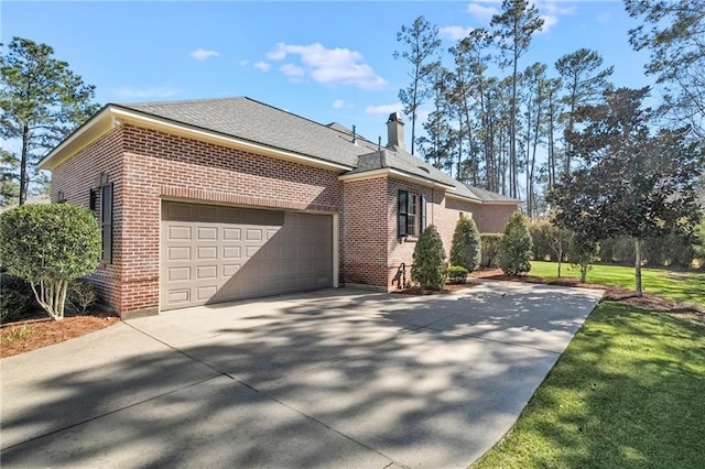 view of side of home with brick siding, a lawn, a chimney, a garage, and driveway