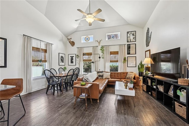 living room with a ceiling fan, wood finished floors, and high vaulted ceiling