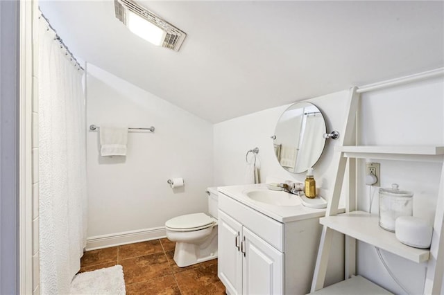 bathroom with visible vents, toilet, baseboards, vanity, and vaulted ceiling