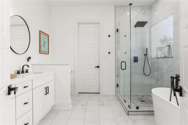 bathroom with a marble finish shower, baseboards, marble finish floor, and vanity