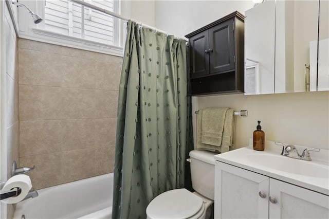 full bath featuring toilet, vanity, and shower / bath combo