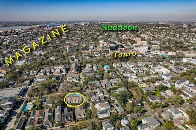drone / aerial view with a water view and a residential view