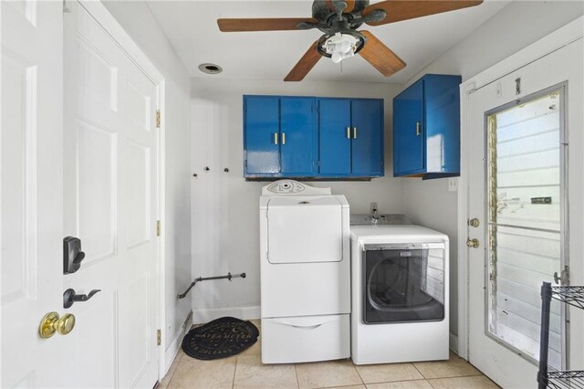 laundry room featuring light tile patterned flooring, cabinet space, ceiling fan, and separate washer and dryer