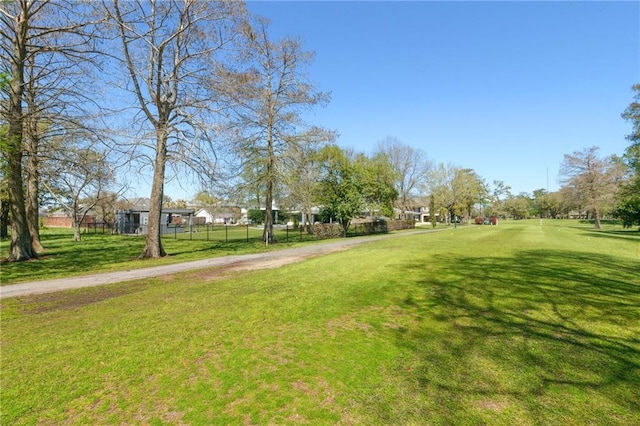 view of home's community featuring a lawn