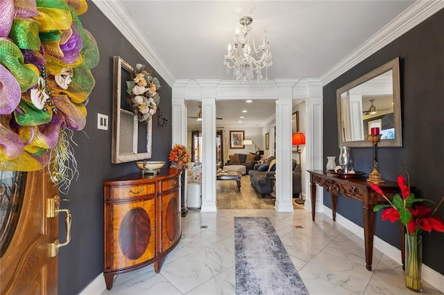 foyer featuring crown molding, baseboards, marble finish floor, and ornate columns