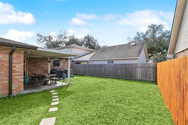 view of yard with a patio and a fenced backyard