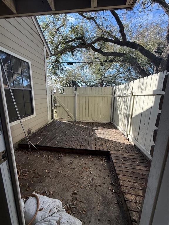 view of yard with fence and a wooden deck