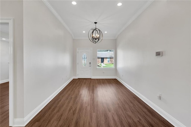 foyer entrance with recessed lighting, crown molding, and baseboards