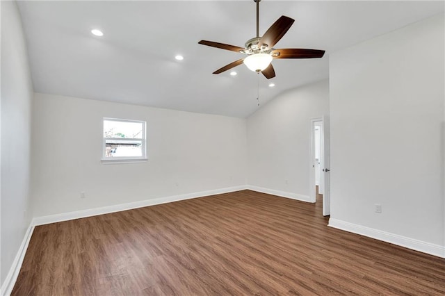 unfurnished room with recessed lighting, baseboards, lofted ceiling, and dark wood-type flooring