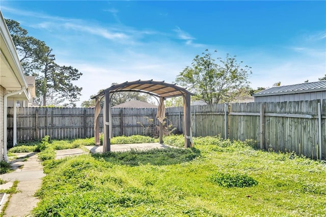 view of yard with a fenced backyard