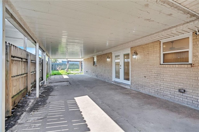 view of patio / terrace with french doors and fence